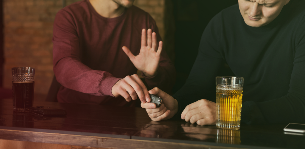 Friend tries to prevent someone holding car keys from driving after drinking